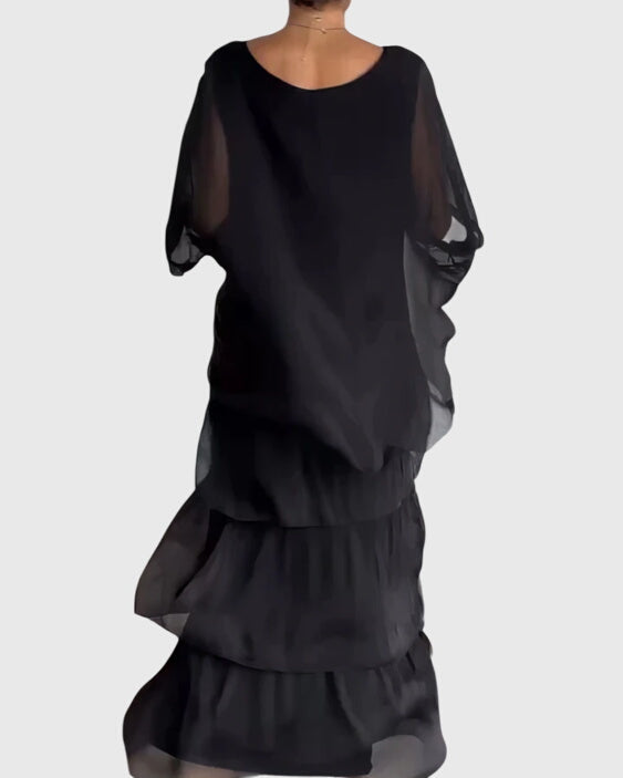 Flowy bohemian maxi dress for women with vibrant abstract print, ideal for a comfortable yet elegant look.