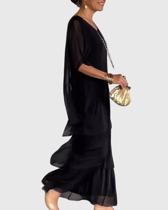 Stylish women's tiered maxi dress featuring a unique abstract pattern, great for casual summer wear.