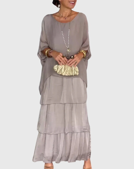 Tiered boho maxi dress for women featuring a beautiful abstract pattern, versatile for day or night.