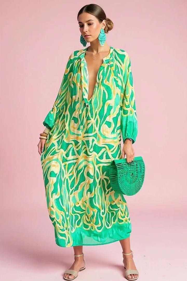Women's abstract print V-neck kaftan maxi dress. Perfect for resort wear, beach, or summer vacation. Flowy & relaxed fit.