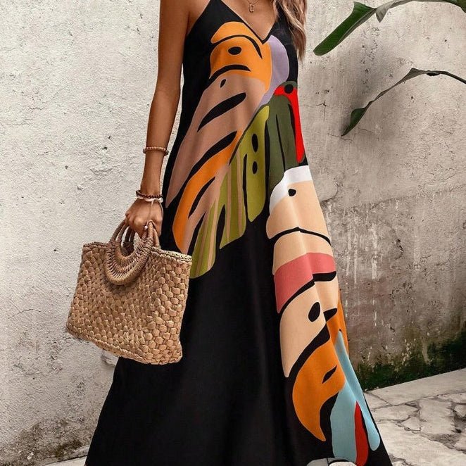 Women's abstract print V-neck maxi sundress. Effortless flowing tropical summer dress with spaghetti straps.