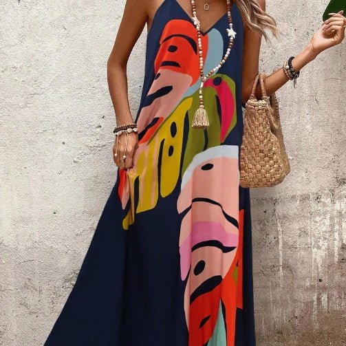 Tropical print maxi sundress for women. Flowing V-neck vacation dress with an abstract pattern, perfect for beachwear.