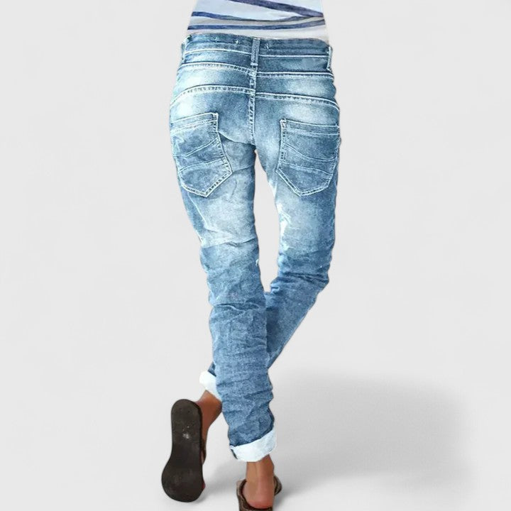 Stylish women's acid wash skinny jeans, button fly, and bold contrast stitching for a vintage feel.
