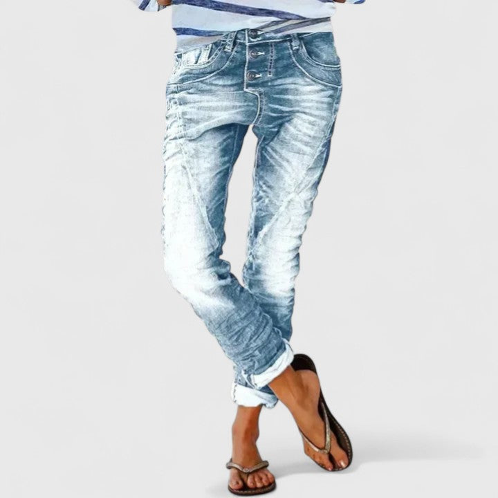 Casual women's acid wash skinny jeans, distressed denim, with striking contrast stitching detail.