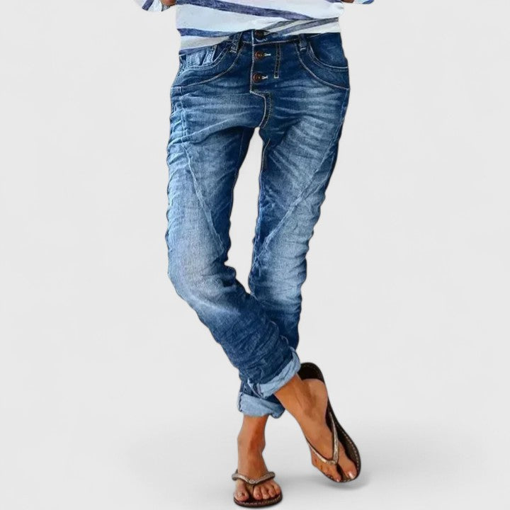 Modern women's acid wash skinny jeans, button fly closure, and eye-catching contrast stitching.