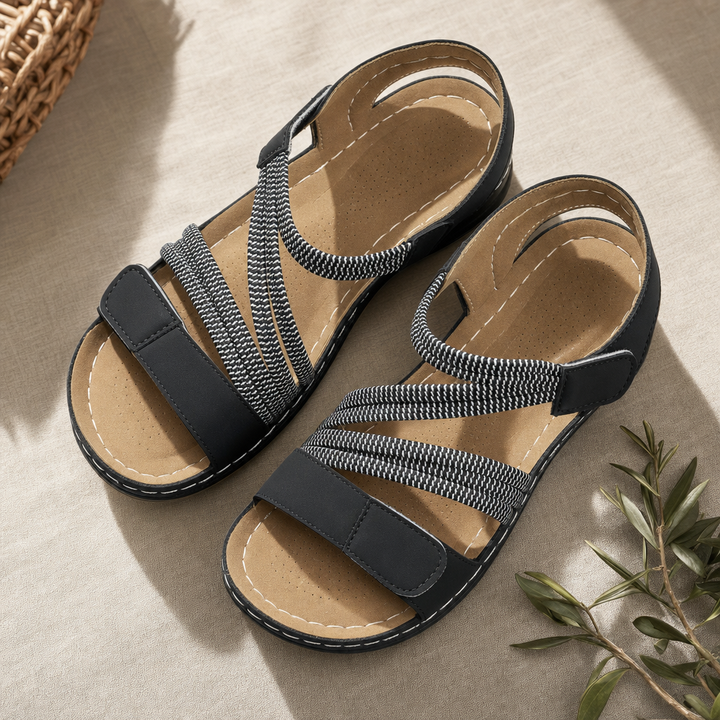 Women's open-toe comfort sandals, featuring adjustable straps and a cushioned sole for summer walks.