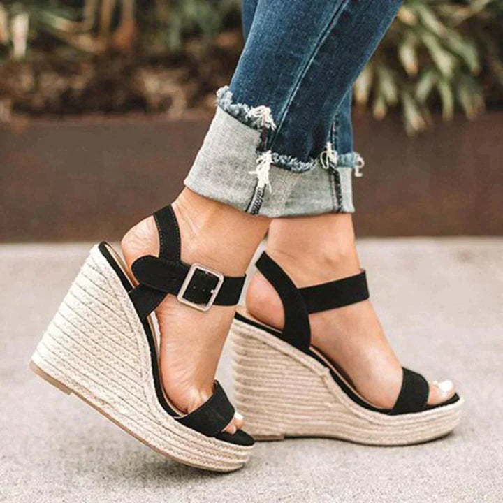Elegant women's woven wedge sandals with adjustable straps, offering comfortable and stylish summer footwear.