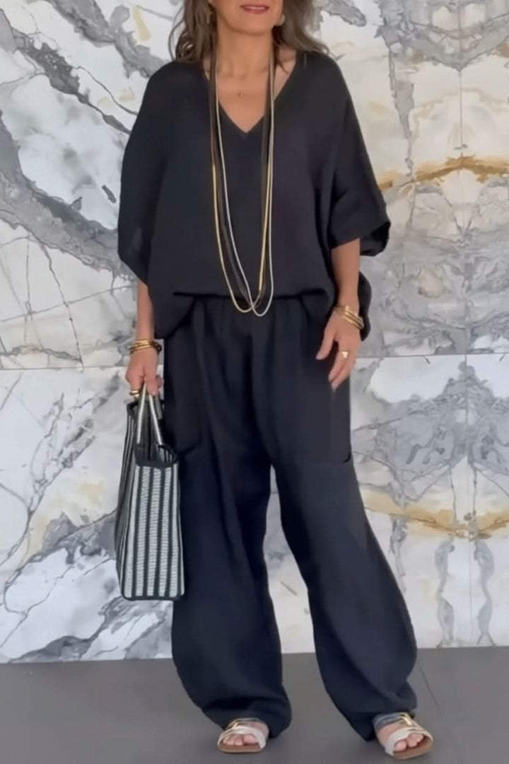 Versatile women's open back pantsuit set; ideal travel wear, brunch outfit, or elegant summer look.