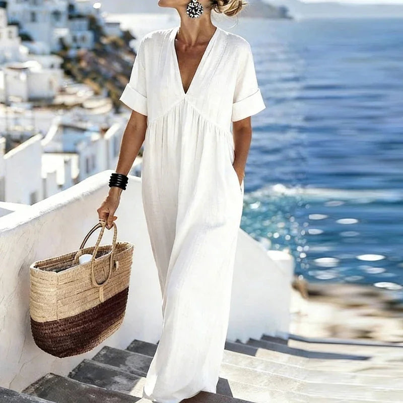 Alisssa Women's V-Neck Maxi Dress, loose fit & bohemian design. Features short sleeves & pockets for ultimate summer comfort.