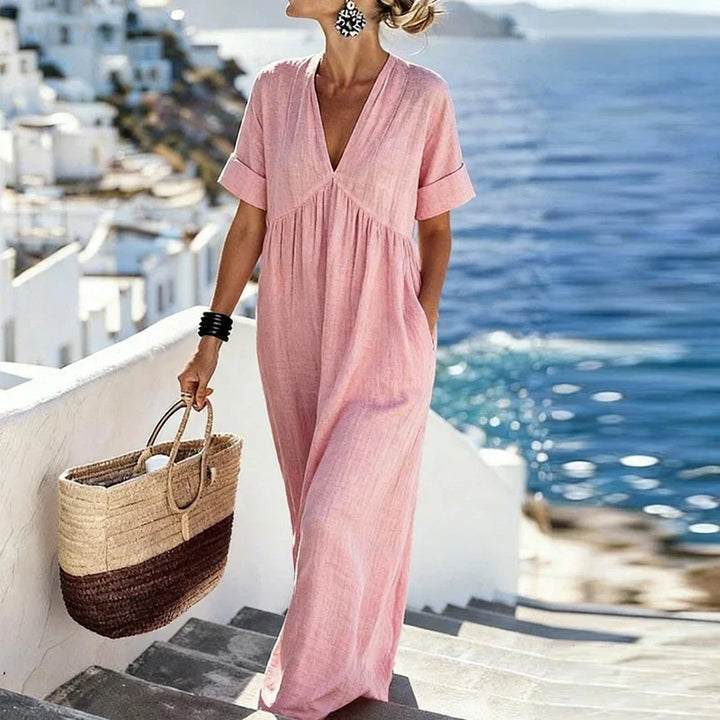 Stylish Women's Bohemian Maxi Dress with V-neckline & convenient pockets. A versatile flowing dress for summer fashion.