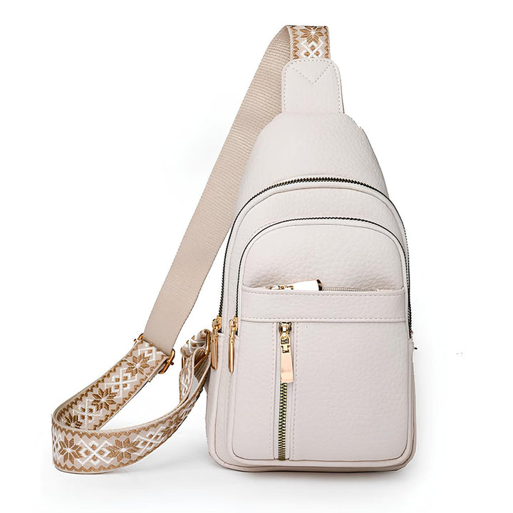 Stylish women's anti-theft crossbody bag with patterned strap & RFID protection for secure travel.