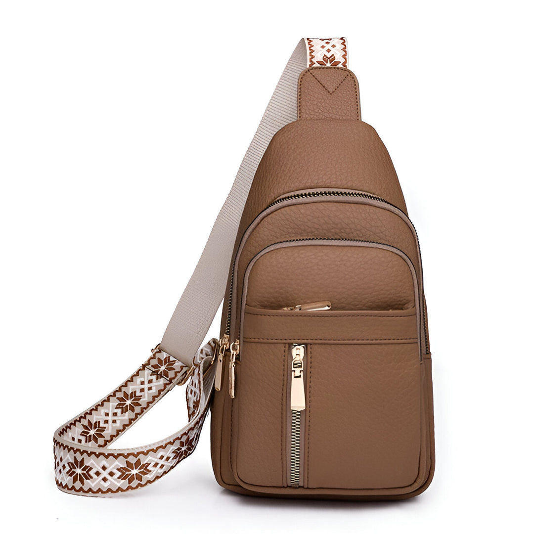 Versatile women's sling bag with adjustable patterned strap. Chic anti-theft crossbody for daily wear.