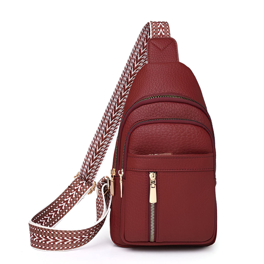 Close-up of patterned strap on women's anti-theft sling bag. Stylish & secure everyday crossbody purse.