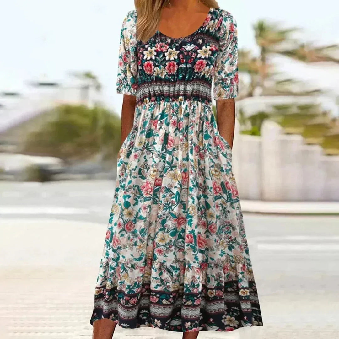 Elegant Women's Bohemian Midi Dress. Flowy floral summer dress with a relaxed fit, short sleeves, and pockets.