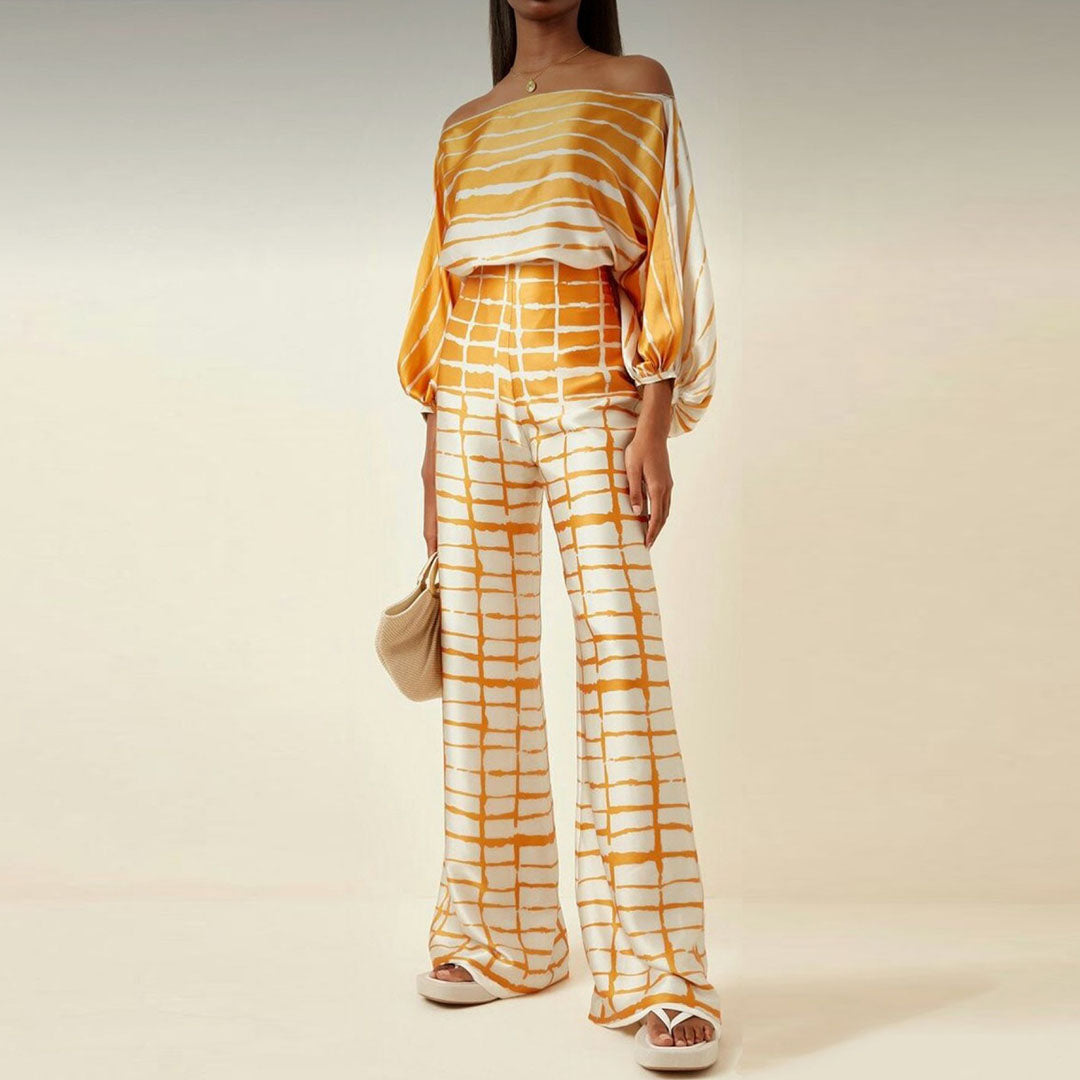 Versatile women's artistic printed two-piece pants set. One-shoulder top & wide leg, ideal for elegant casual.