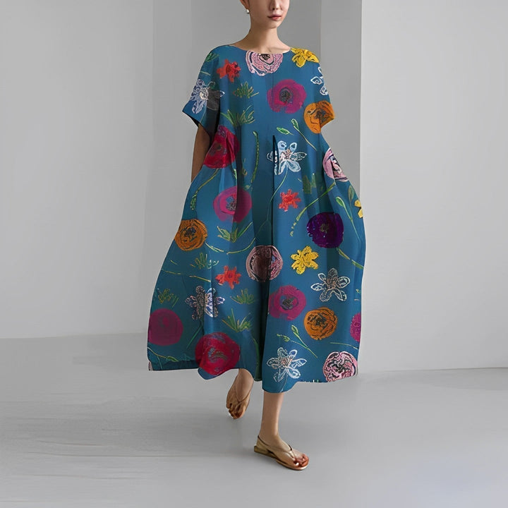 Short sleeve round neck women's midi dress with an artistic print, relaxed fit, and convenient side pockets.