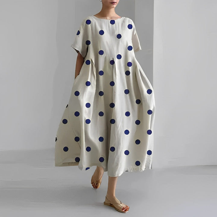 Lightweight women's midi dress with artistic print, relaxed fit, short sleeves, ideal summer and vacation outfit.