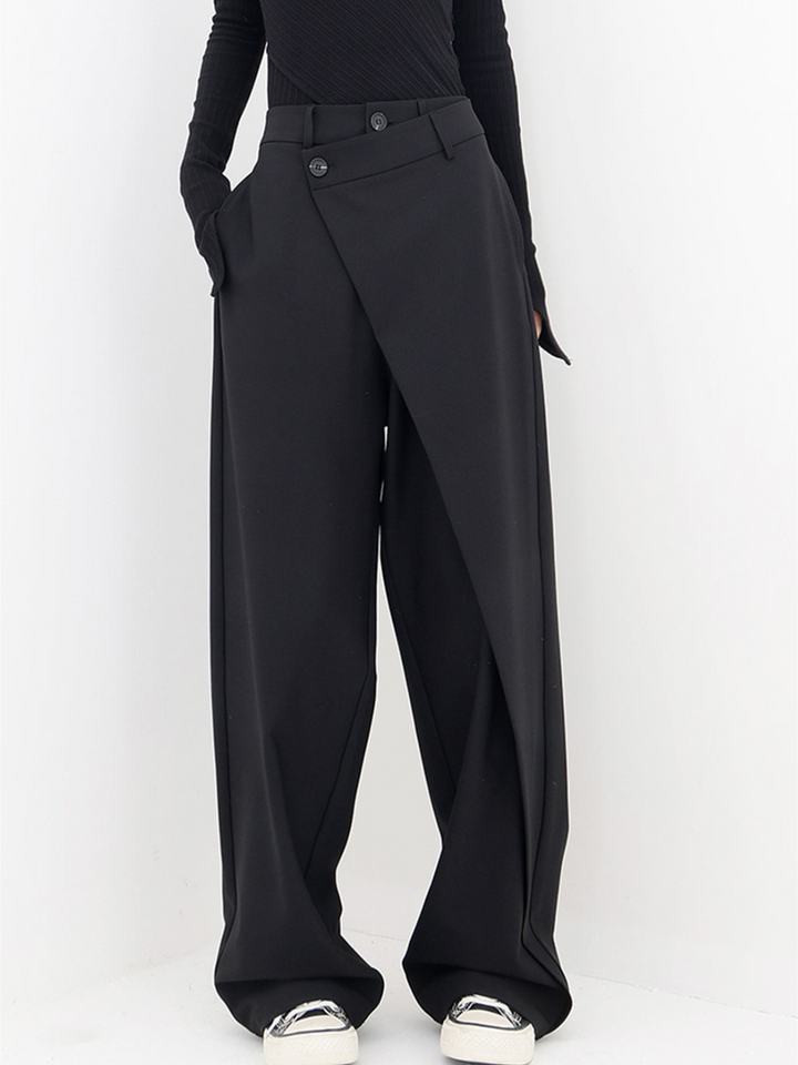 Women's asymmetric baggy trousers in relaxed fit. Modern casual chic pants for daily wear & comfort.