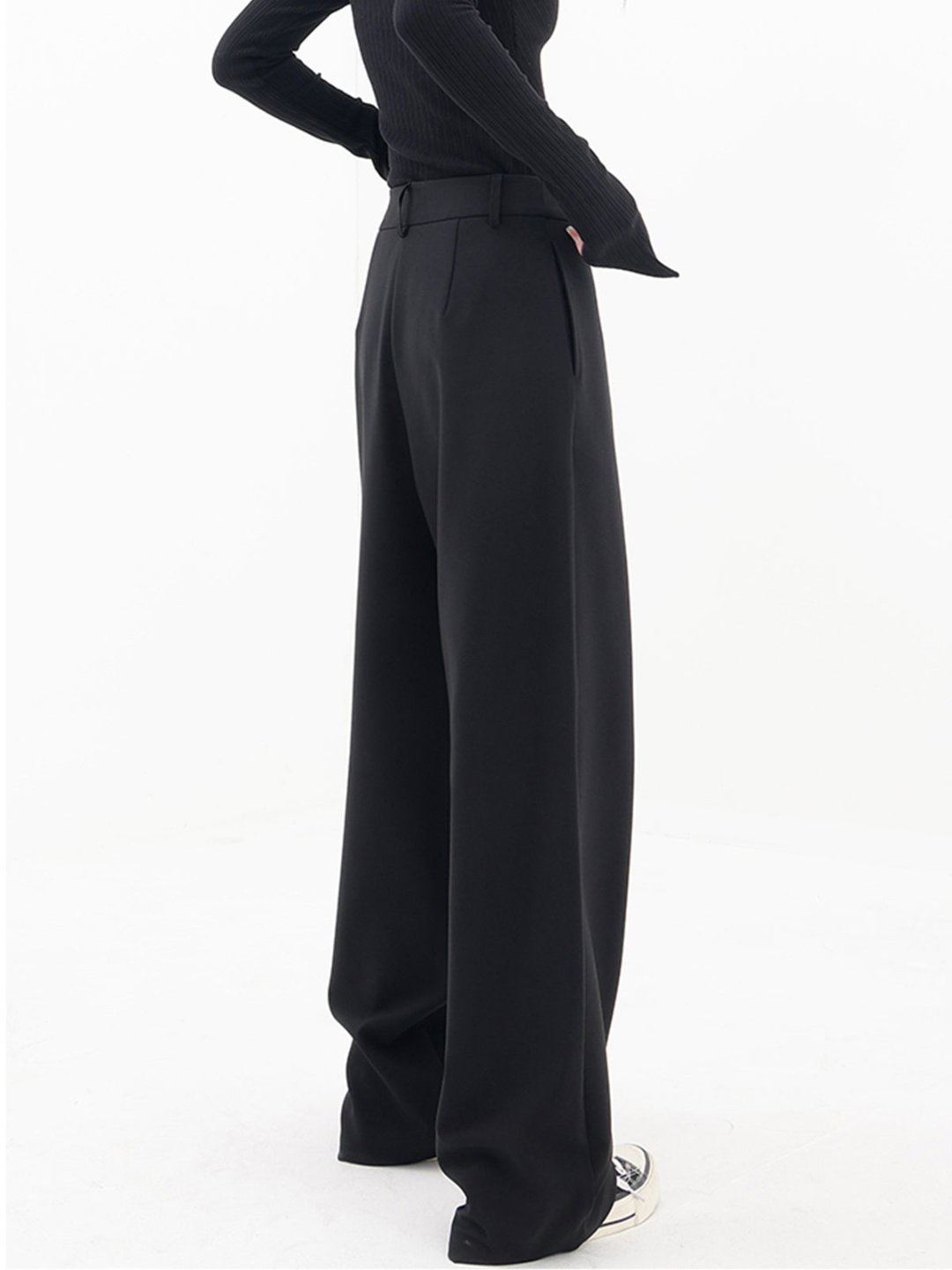 Women wearing versatile asymmetric baggy trousers, demonstrating a relaxed & chic daily wear look.