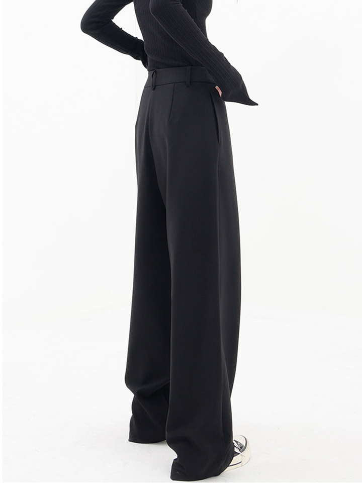 Women wearing versatile asymmetric baggy trousers, demonstrating a relaxed & chic daily wear look.