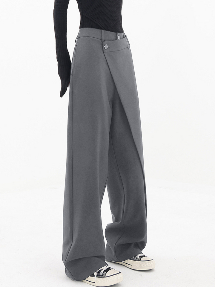 Chic women's baggy trousers with an asymmetric hem. Relaxed fit pants, a versatile addition to any wardrobe.