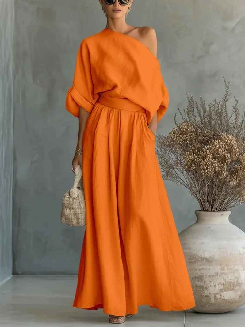 Effortless women's fashion with this asymmetric drape top & wide leg pant set, perfect for resort style.