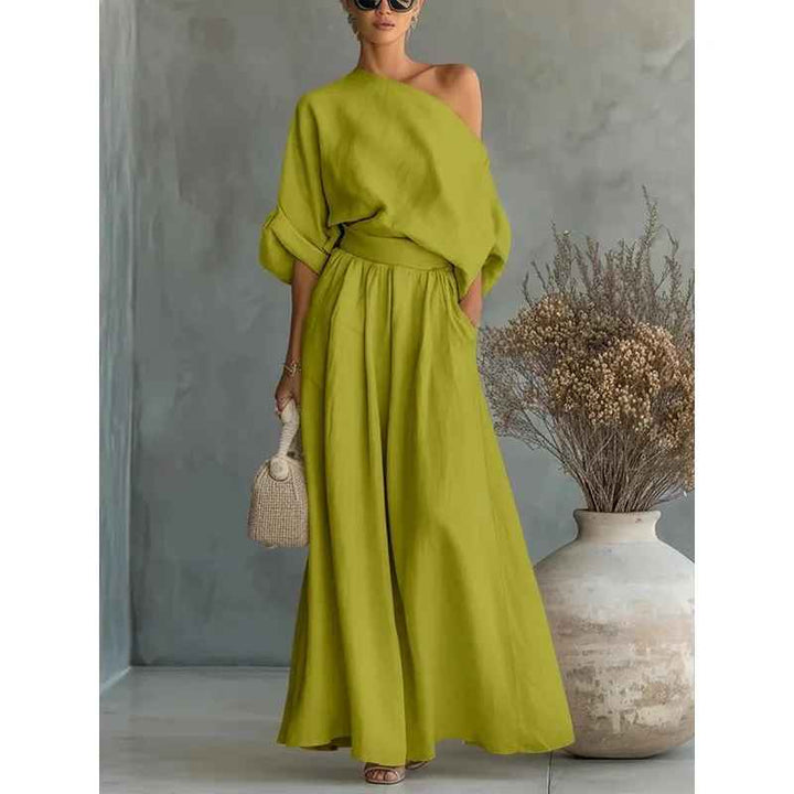 Sophisticated women's summer chic two-piece set: asymmetric drape top and flowy wide leg pants.