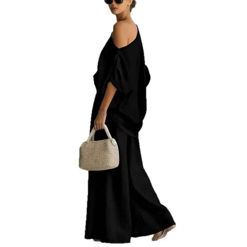 Versatile women's asymmetric drape top & wide leg pant set, offering an elegant and relaxed fit.