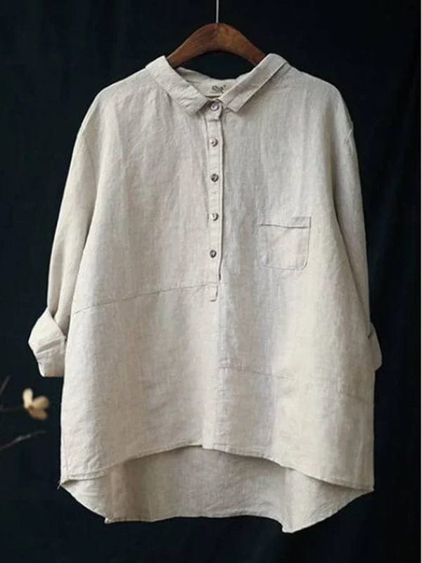 Stylish women's button-up blouse with an asymmetrical hem. Perfect for versatile casual and everyday fashion.