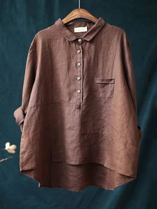 Front view of a collared women's button-up shirt with a modern asymmetrical hem. Effortless casual everyday style.