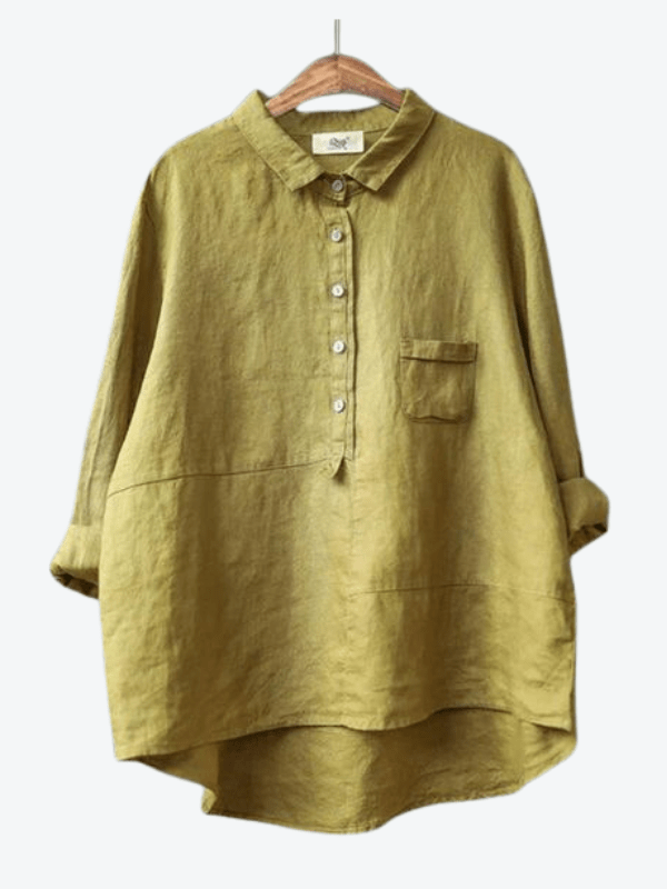 Women's casual long sleeve collared blouse. Features an asymmetrical hem and button-up front for effortless style.
