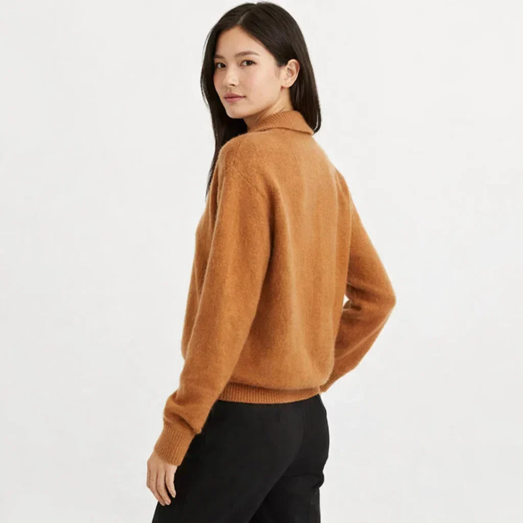 Cozy women's knit cardigan, asymmetrical button design. Ideal for fall fashion, winter style, and casual layering.