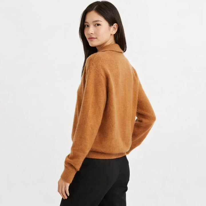 Cozy women's knit cardigan, asymmetrical button design. Ideal for fall fashion, winter style, and casual layering.