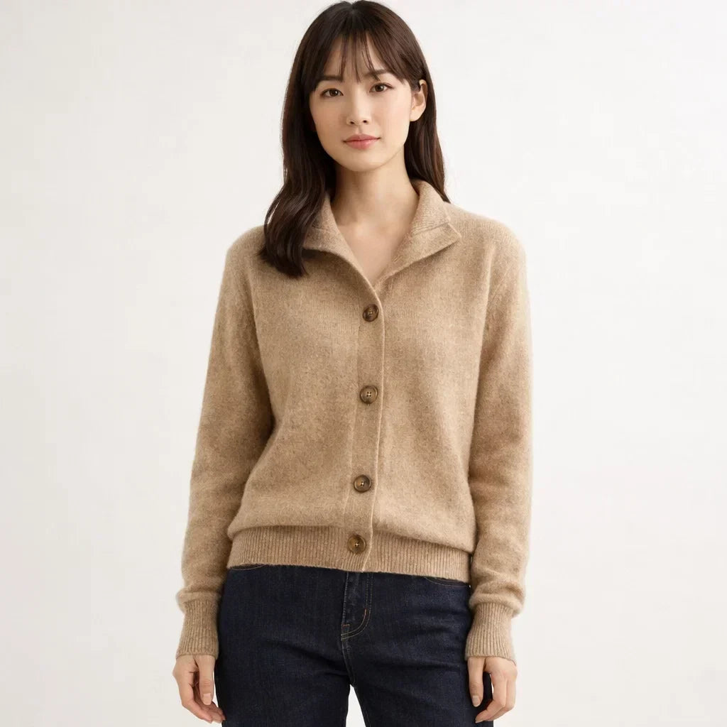 Long sleeve women's knit cardigan featuring a unique asymmetrical button placket. A warm, stylish fall/winter layering piece.