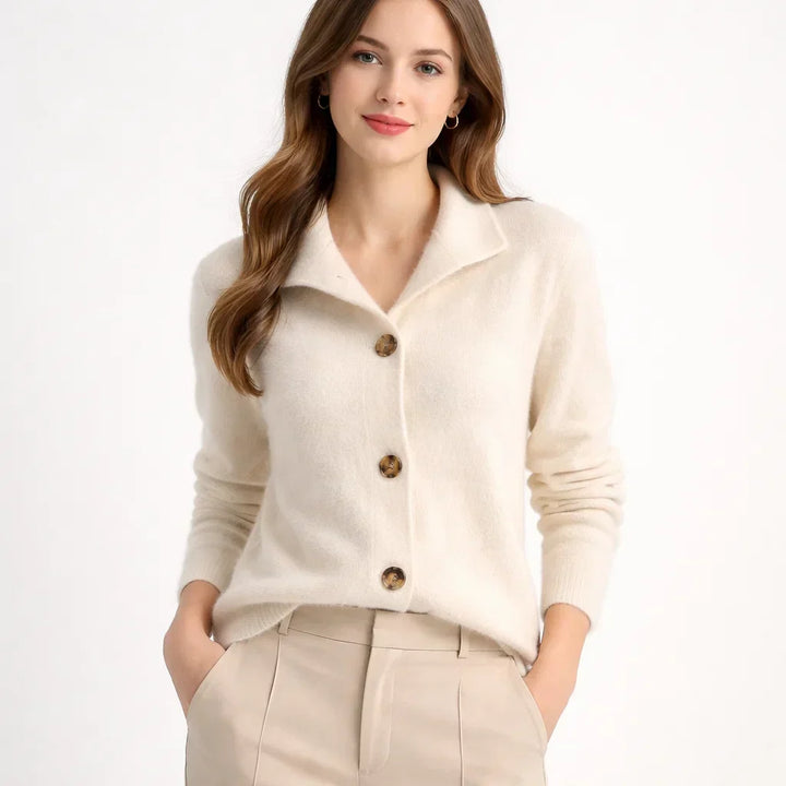 Warm women's knit cardigan with an eye-catching asymmetrical button placket. Great casual top for fall & winter style.