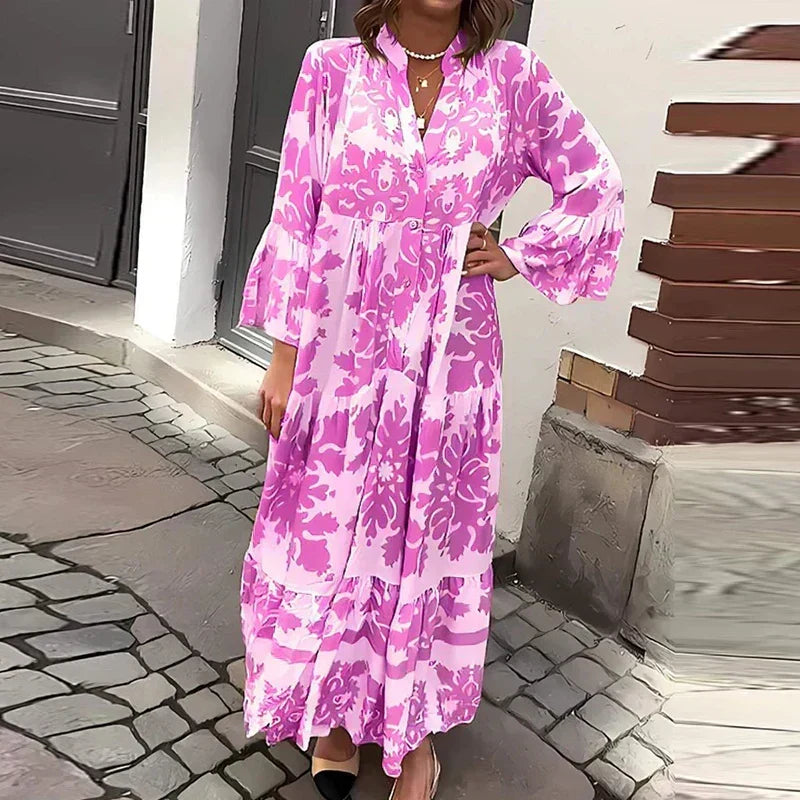 Boho women's maxi dress with intricate baroque print, tiered skirt, and graceful lantern long sleeves.