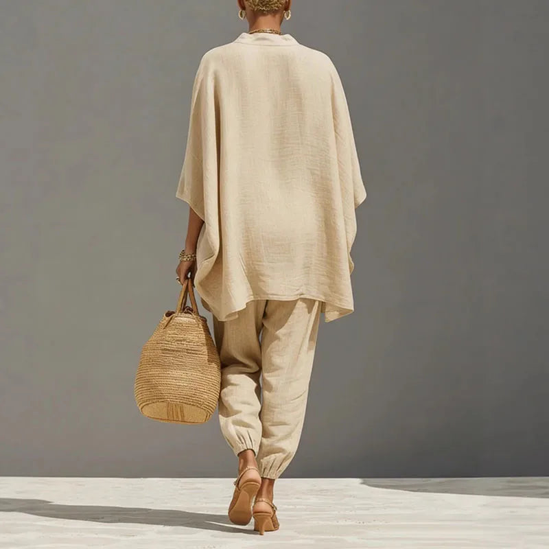Stylish women's batwing sleeve top & tapered pants two-piece matching set, ideal loungewear.