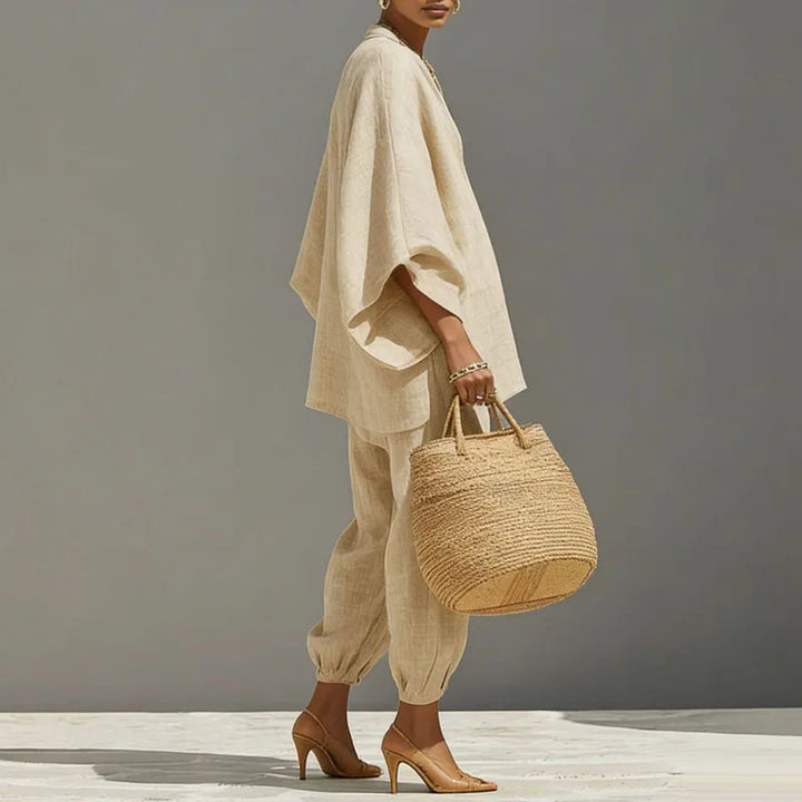 Chic women's batwing sleeve top & tapered pants, a modern two-piece matching set for casual style.