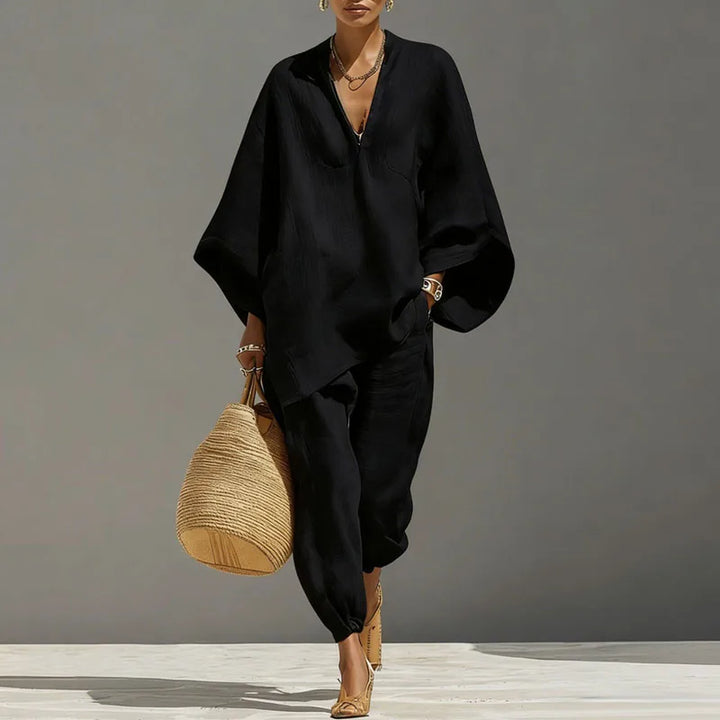 Trendy women's two-piece matching set with batwing sleeves & relaxed fit tapered pants for summer.