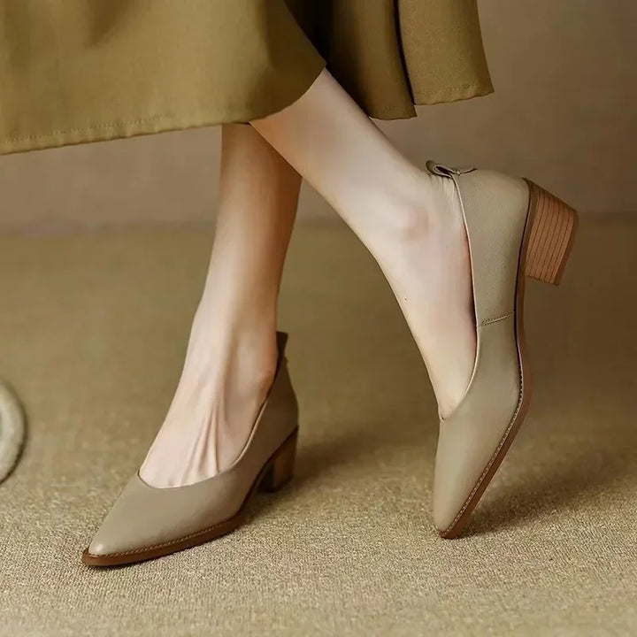Women's beige pointed toe slip-on mid block heel court shoes, elegant & versatile style.