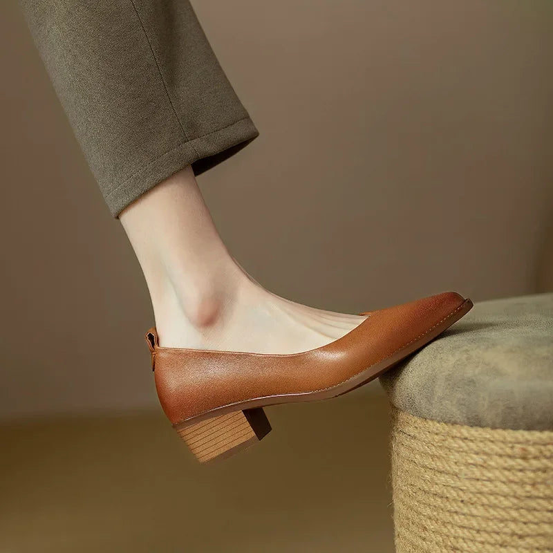 Versatile women's slip-on court shoes, pointed toe & mid block heel, ideal for elegant casual outfits.