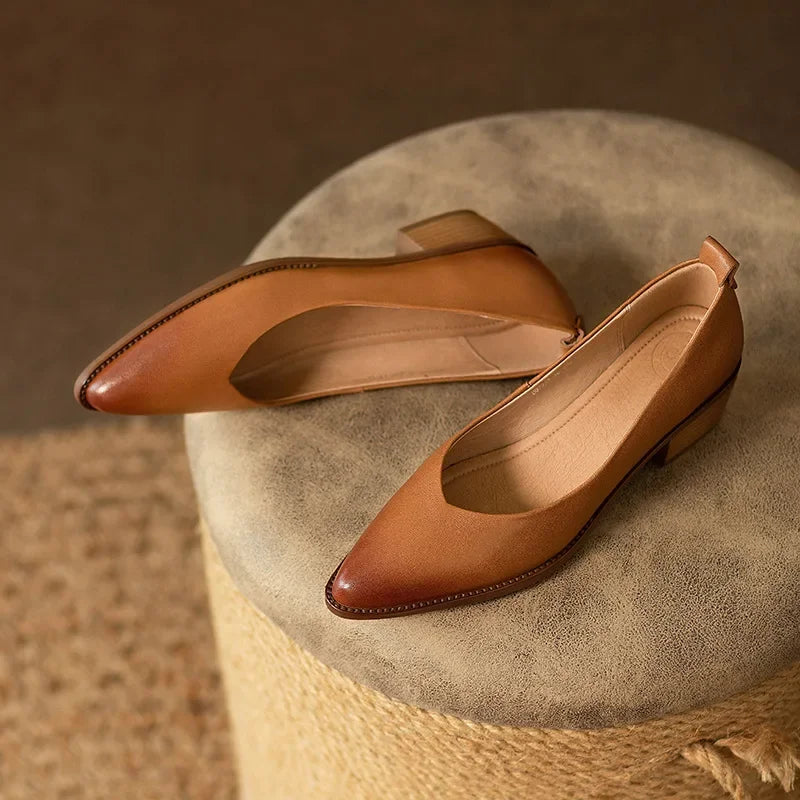 Chic women's beige pointed toe court shoes, slip-on design with a stable mid block heel for professional style.