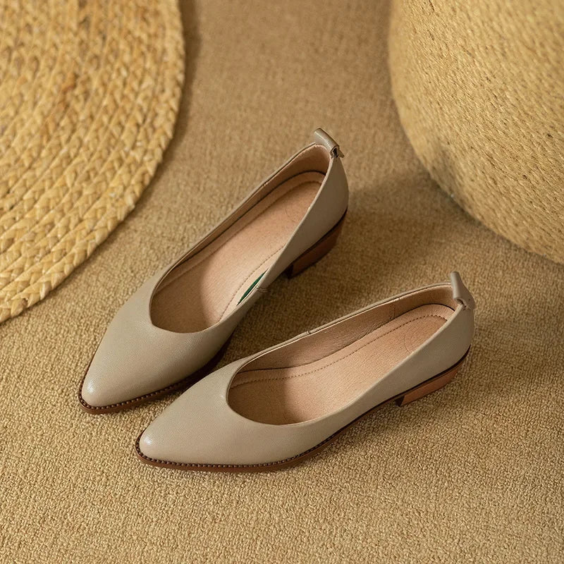 Rear view of women's beige mid block heel court shoes, showcasing the comfortable, sturdy heel design.