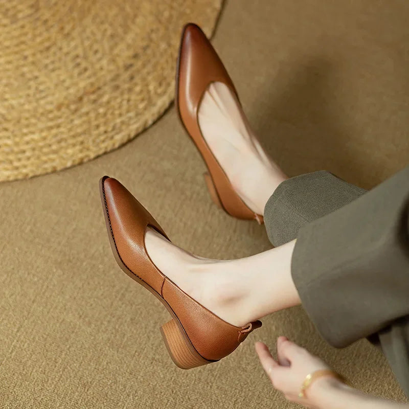 Close-up of the sophisticated pointed toe on women's slip-on court shoes, chic and professional.