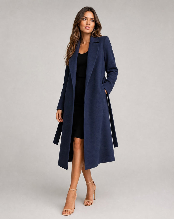 Classic women's trench coat with belt, structured for office fashion & elegant evening style. Fall/winter.