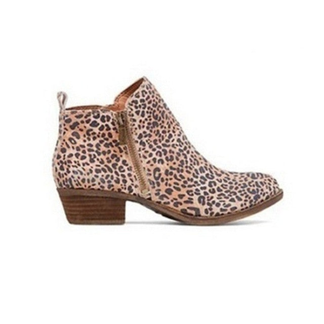 Chic women's block heel ankle boots with a functional side zip, designed for comfortable casual workwear.