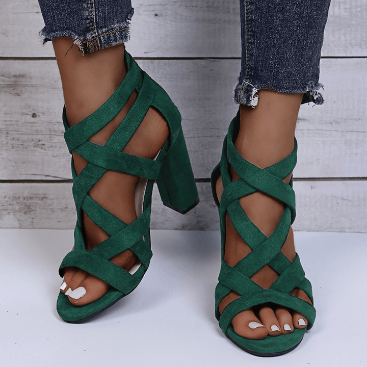 Women's black chunky heel strappy sandals, perfect for occasion wear and fashion-forward looks.