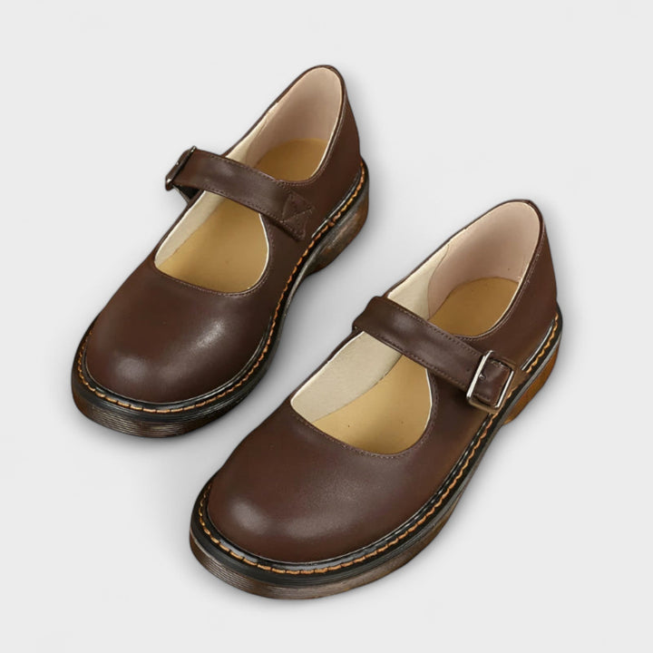Women's black chunky Mary Jane flats with adjustable buckle strap, perfect for retro everyday style.