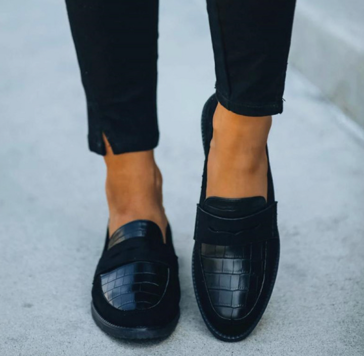Classic black textured loafers for women, featuring a sophisticated crocodile print.