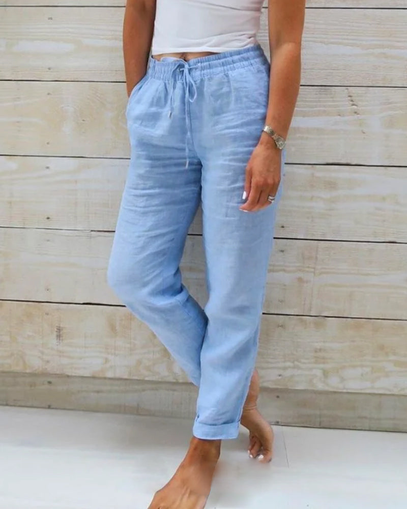 Women's black drawstring straight leg pants with elastic waist for casual, comfortable everyday wear.